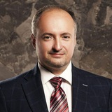 Ростислав Кравець Logo