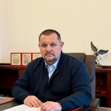 Дмитро Брижинський Logo