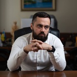 Кирило Фесик Logo